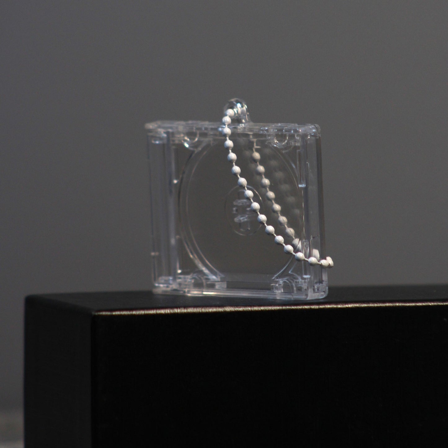 closed case with ball chain hanging